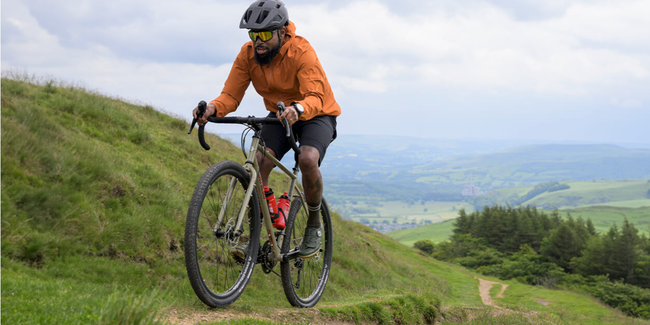 A man riding a gravel bicycle in the mountain.