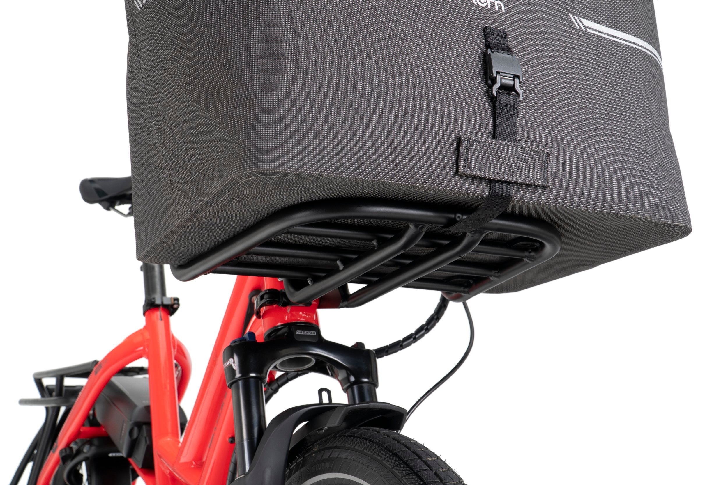 Red electric bike with a black front storage box on a white background