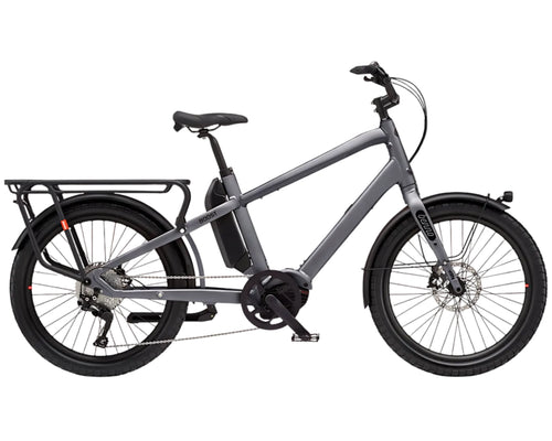 Grey electric cargo bicycle with a basket on a white background