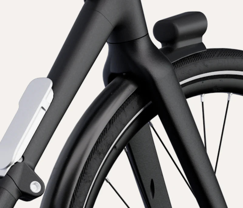 Close-up of a black bicycle frame with a white background