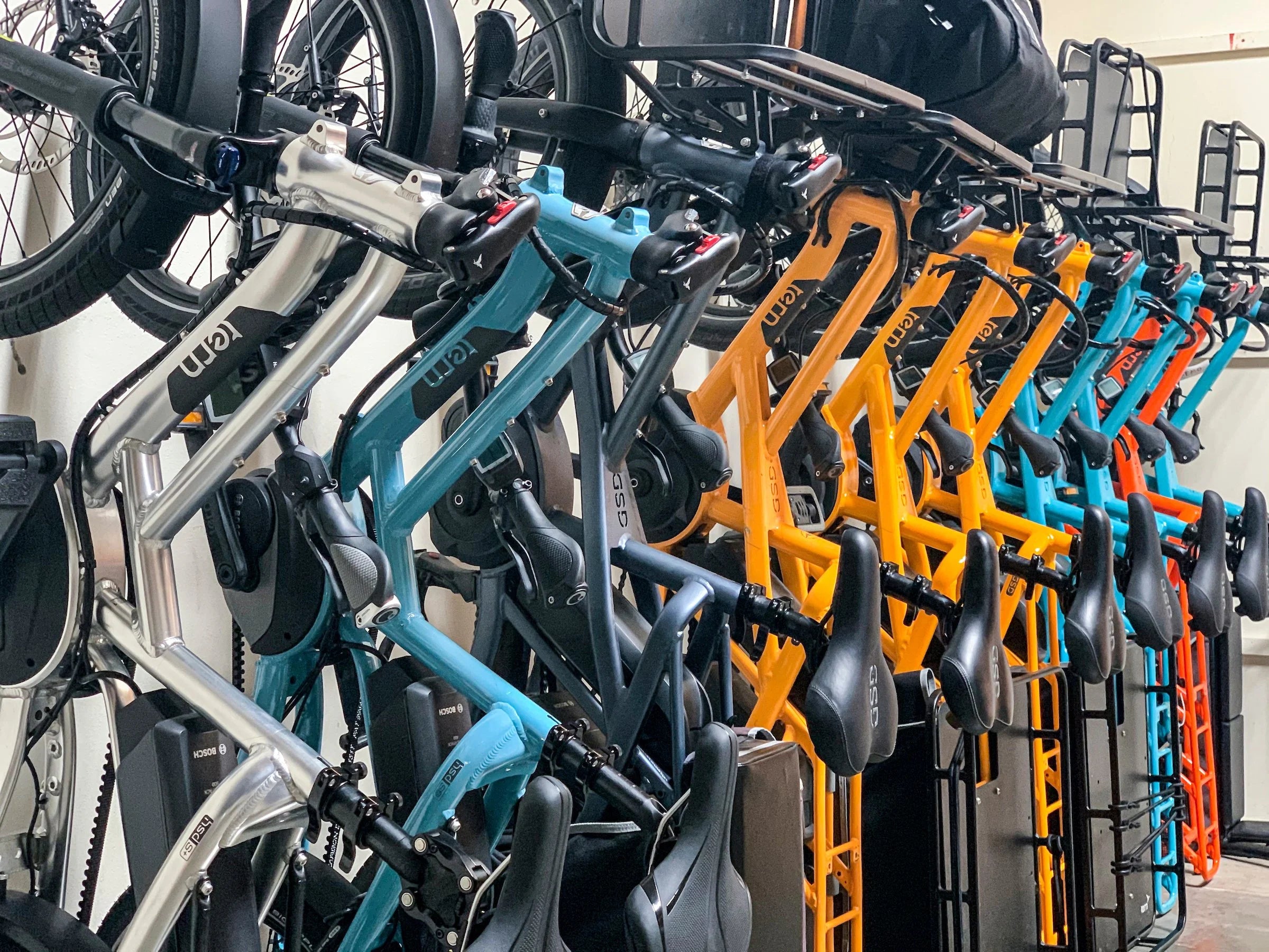 Many bicycles which make up a company bike fleet.