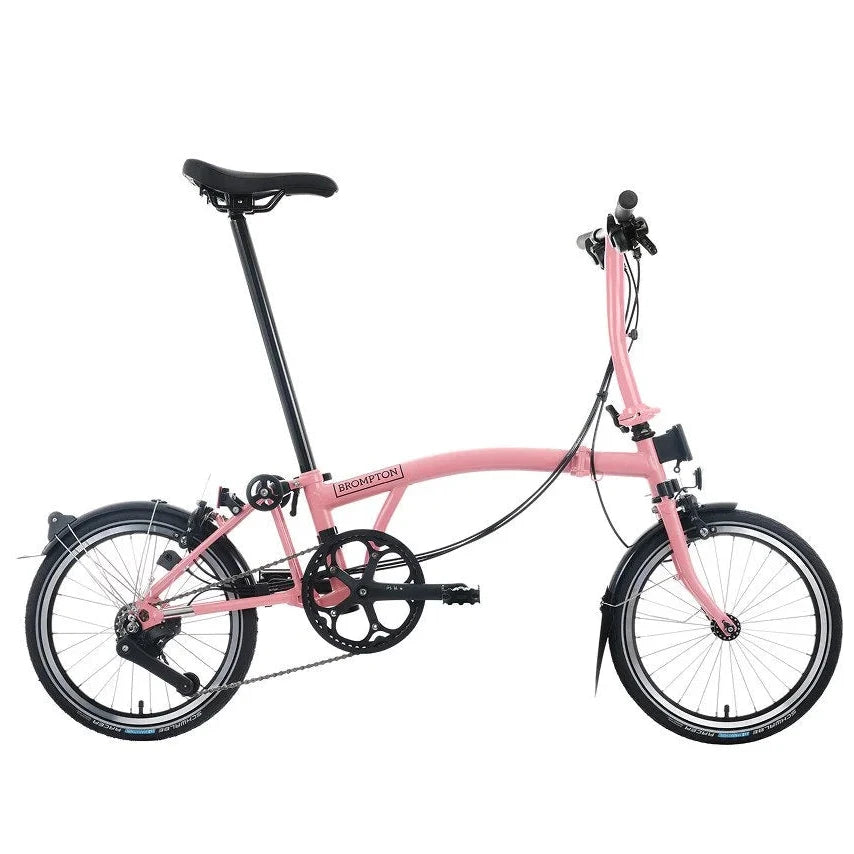 Pink folding bicycle on a white background