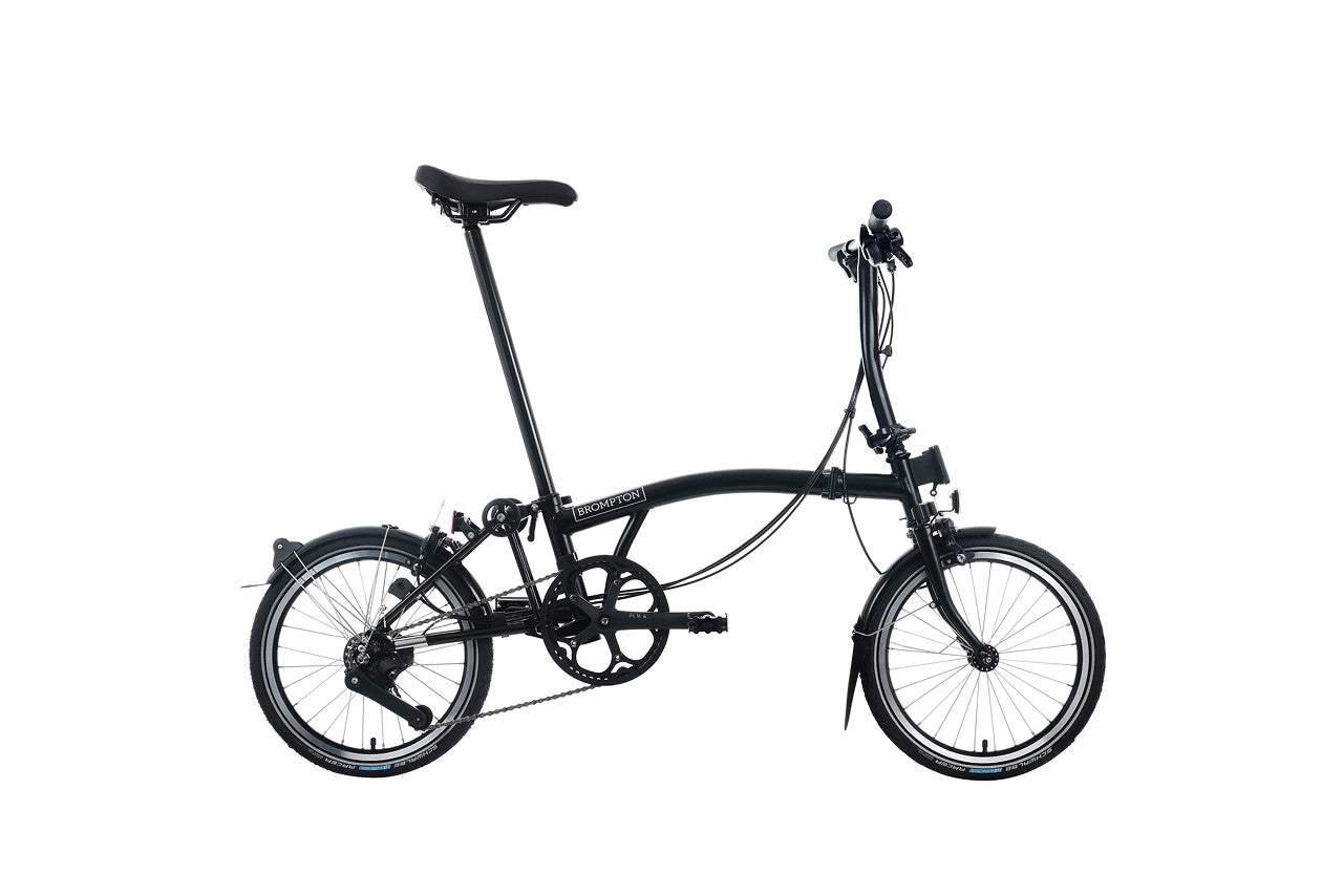 Black folding bicycle on a white background