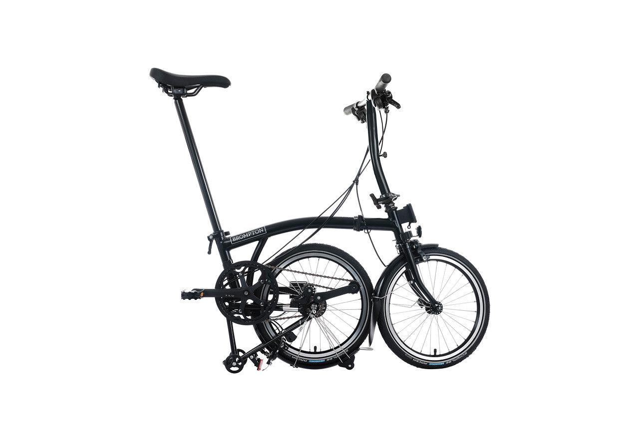 Black folding bicycle on a white background