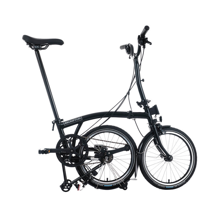 Folded Brompton Bike on the white background