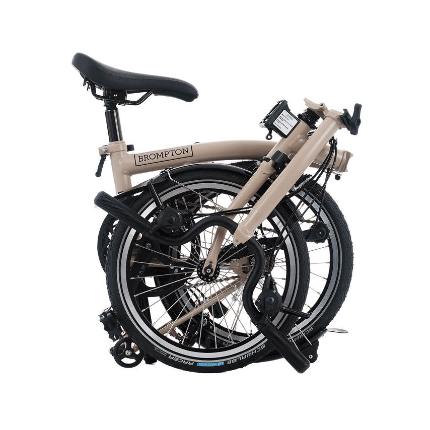Foldable bicycle with 'Brompton' branding on a white background