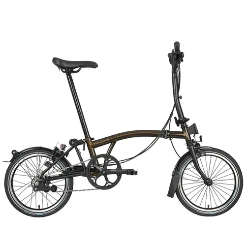 Brown Brompton folding bicycle on a white background.