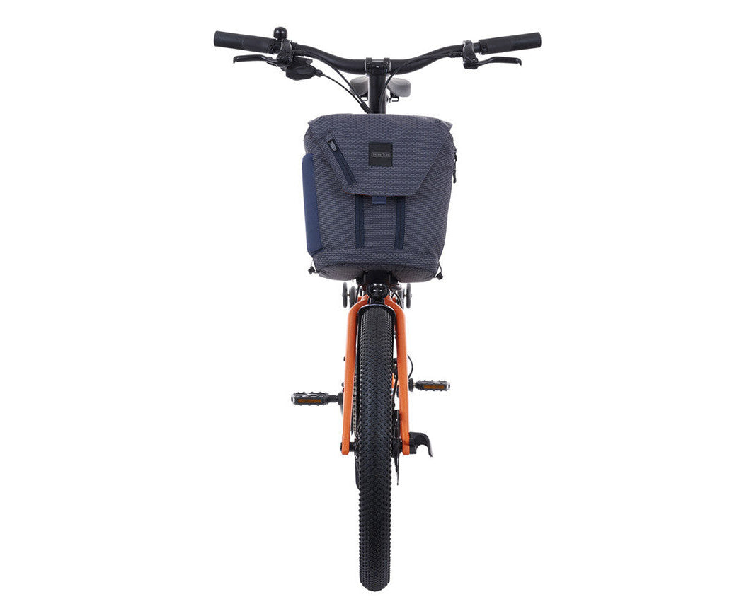 Brompton g Line Electric Bicycle with a blue bag on a white background