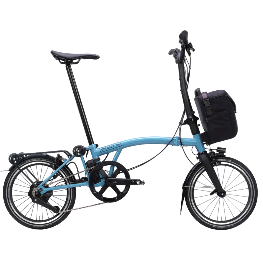 Blue Brompton P Line folding bicycle with a black bag on a white background