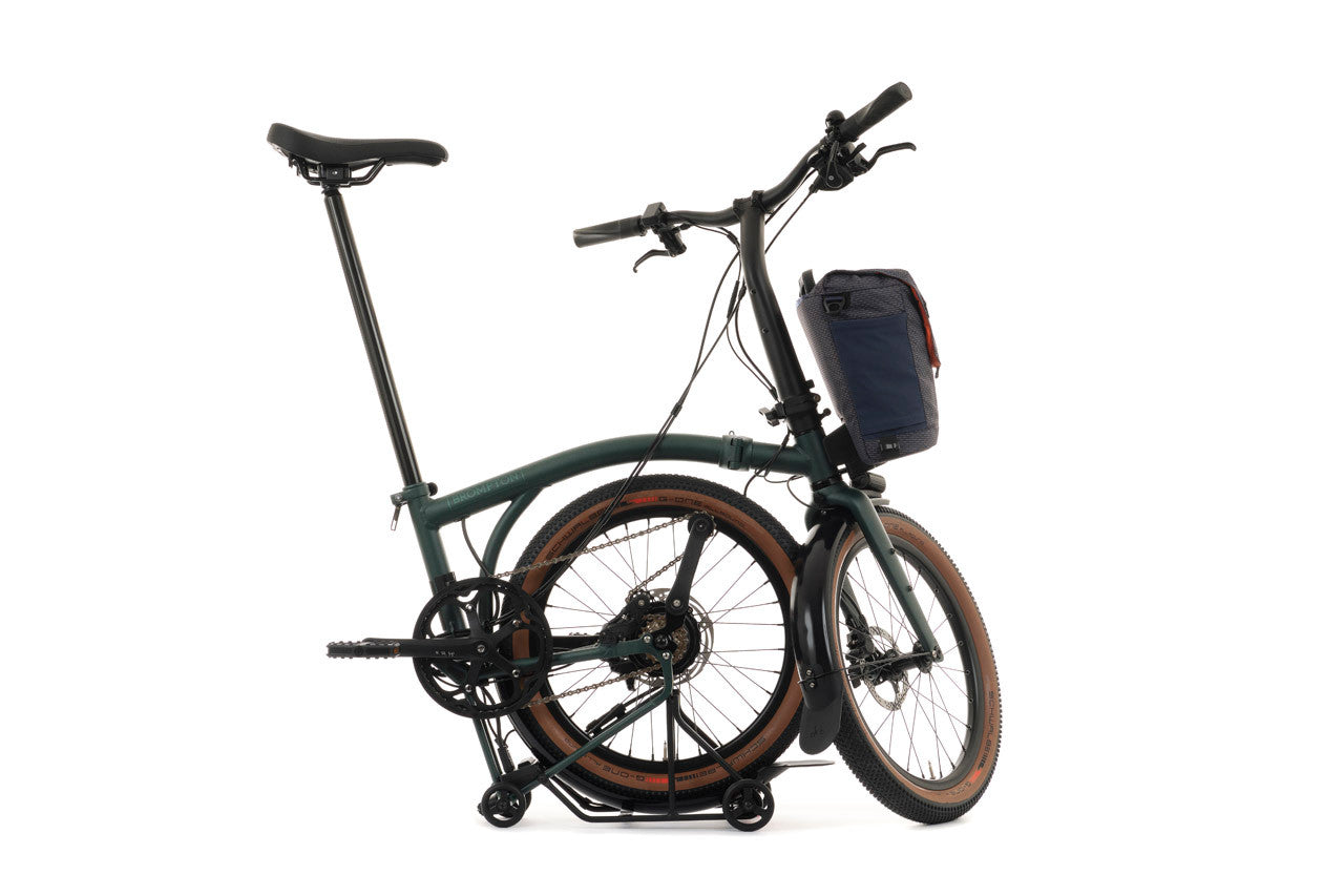 Forest Green Brompton G Line half folded bike on the white background.