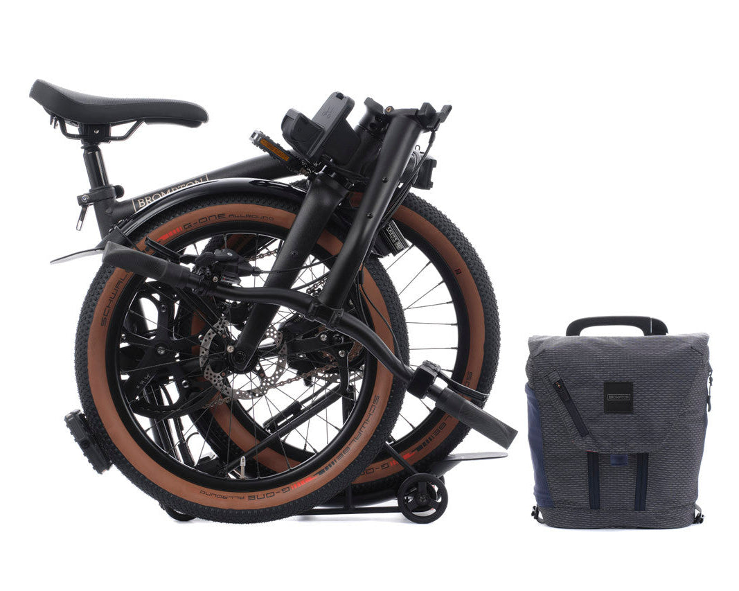 Folded, black Brompton G Line electric on the white background