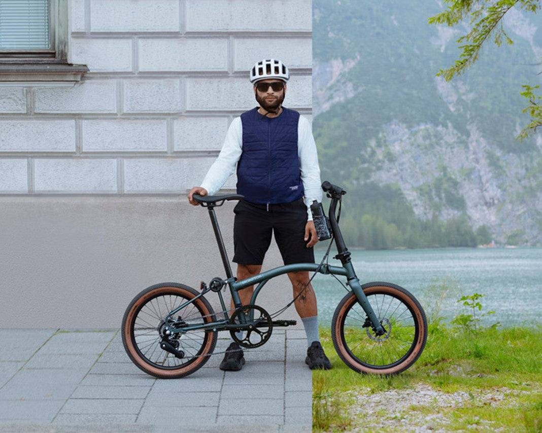 A person holding a Brompton bicycle in two different settings: one urban and one by a lake.