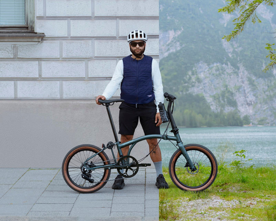 A person holding a Brompton bicycle in two different settings: one urban and one by a lake.