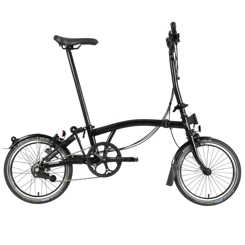 Black Brompton folding bike on the white background.