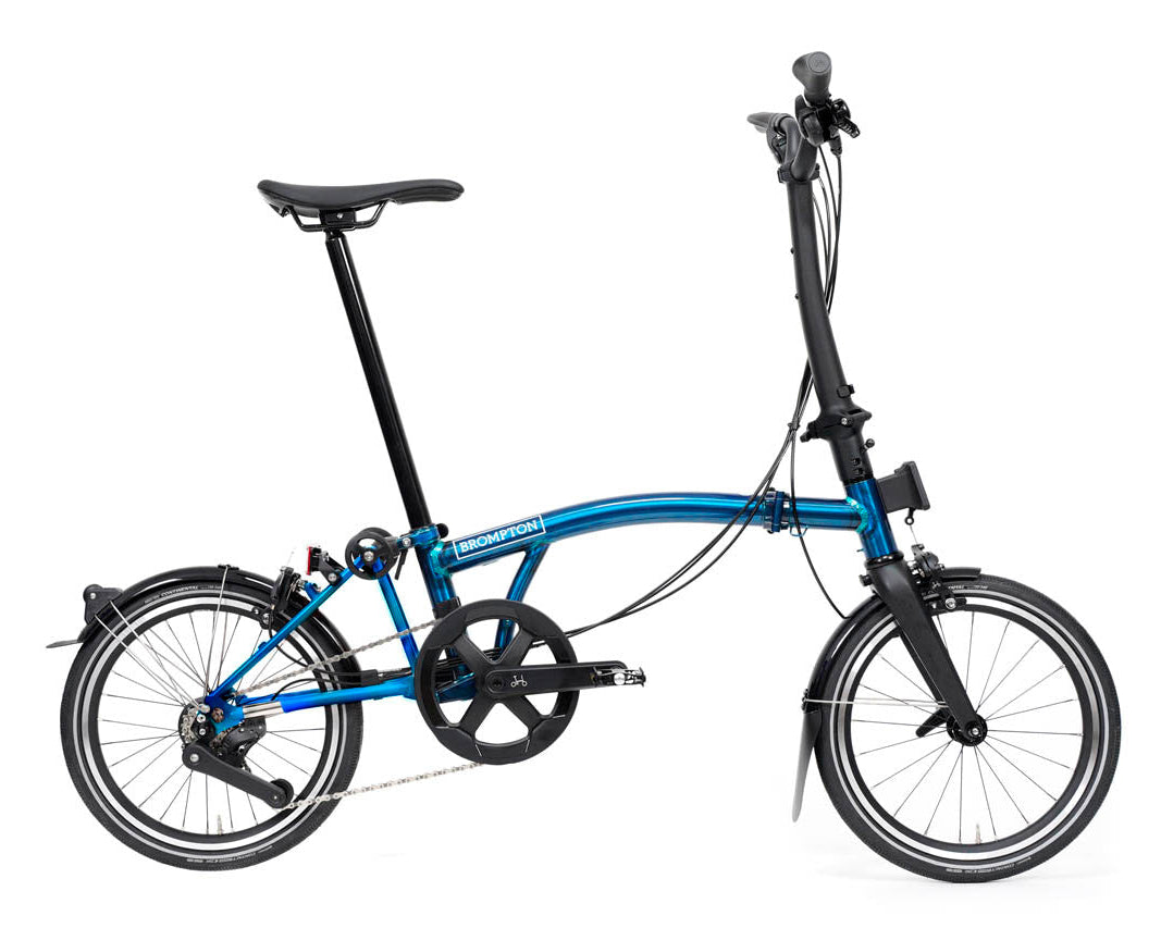 Blue brompton p line folding bike on a white background