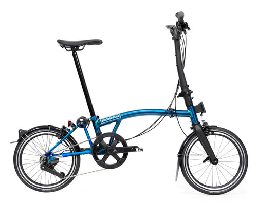 Blue brompton p line folding bike on a white background