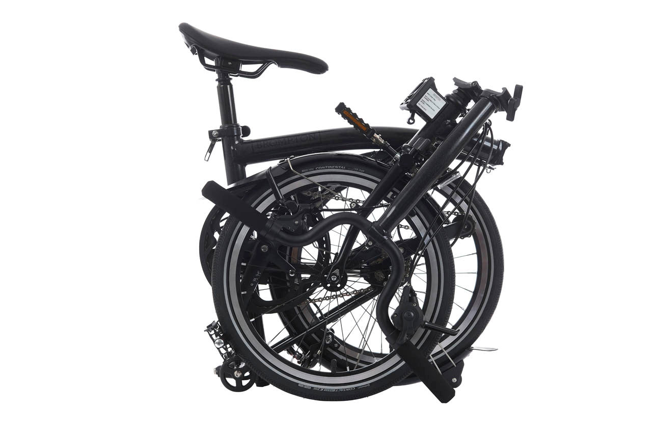 Black folding bicycle on a white background