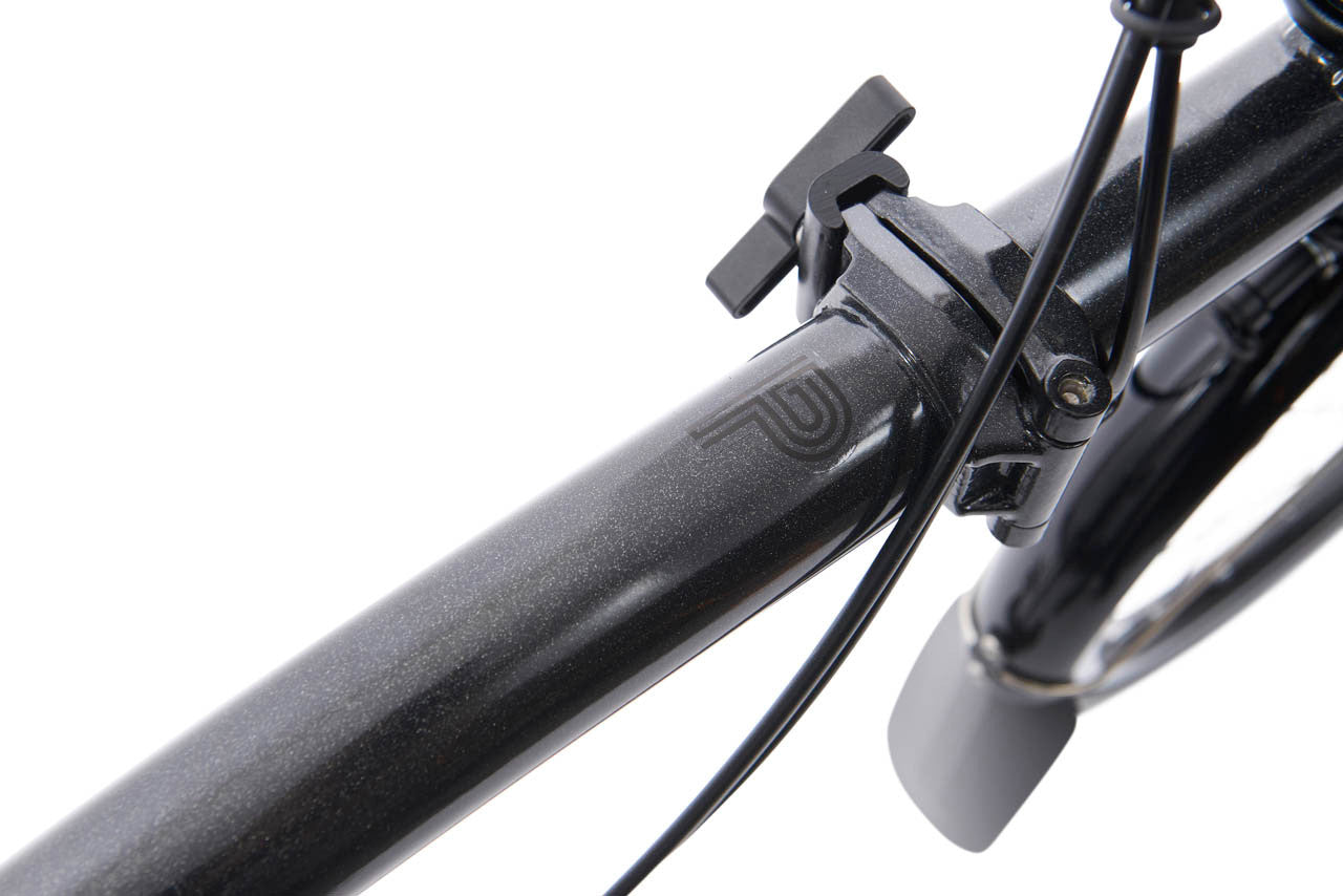 Close-up of a bicycle handlebar with brake lever on a white background