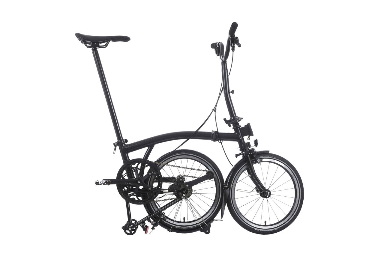 Black folding bicycle on a white background