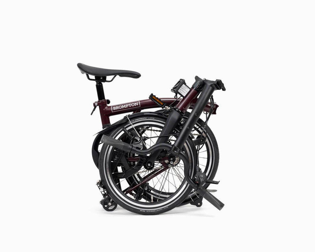 Folded Brompton P Line bike on a white background