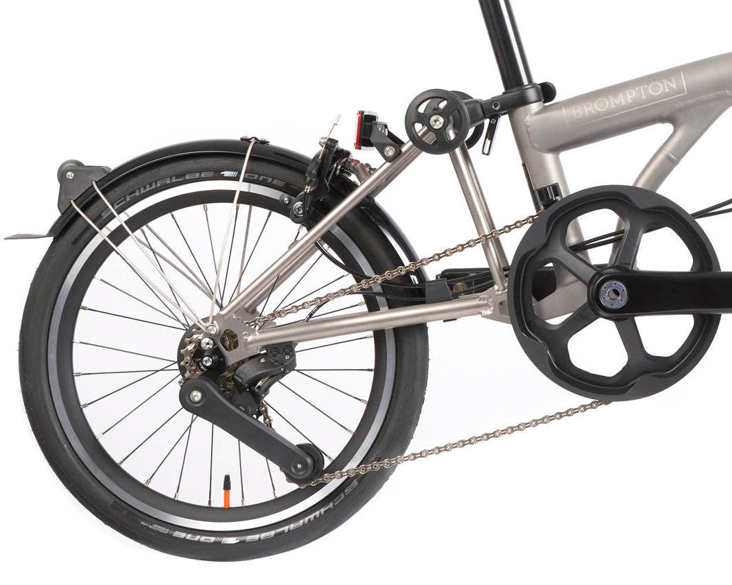 Close-up of a bicycle's gear system on a white background