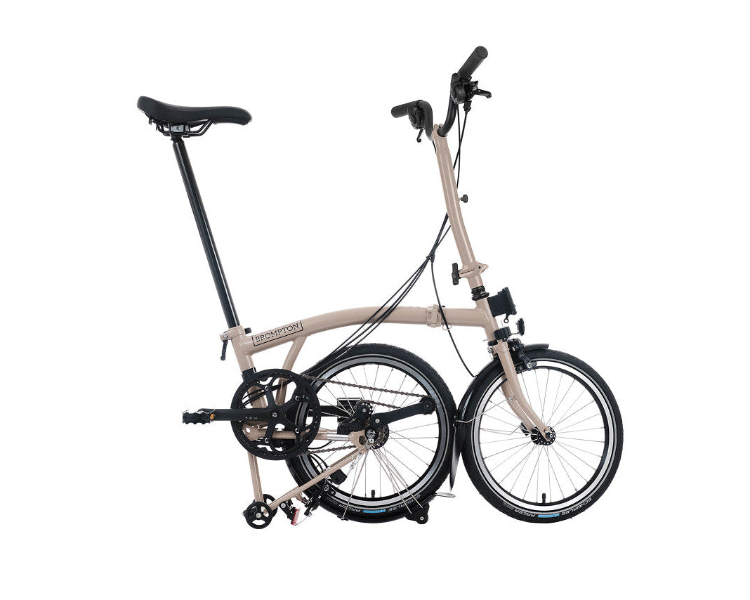 Brompton folding bicycle on a white background