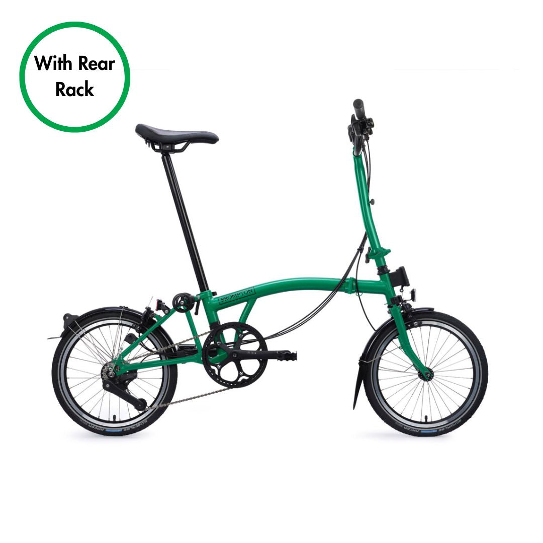 Green folding bicycle with a rear rack on a white background