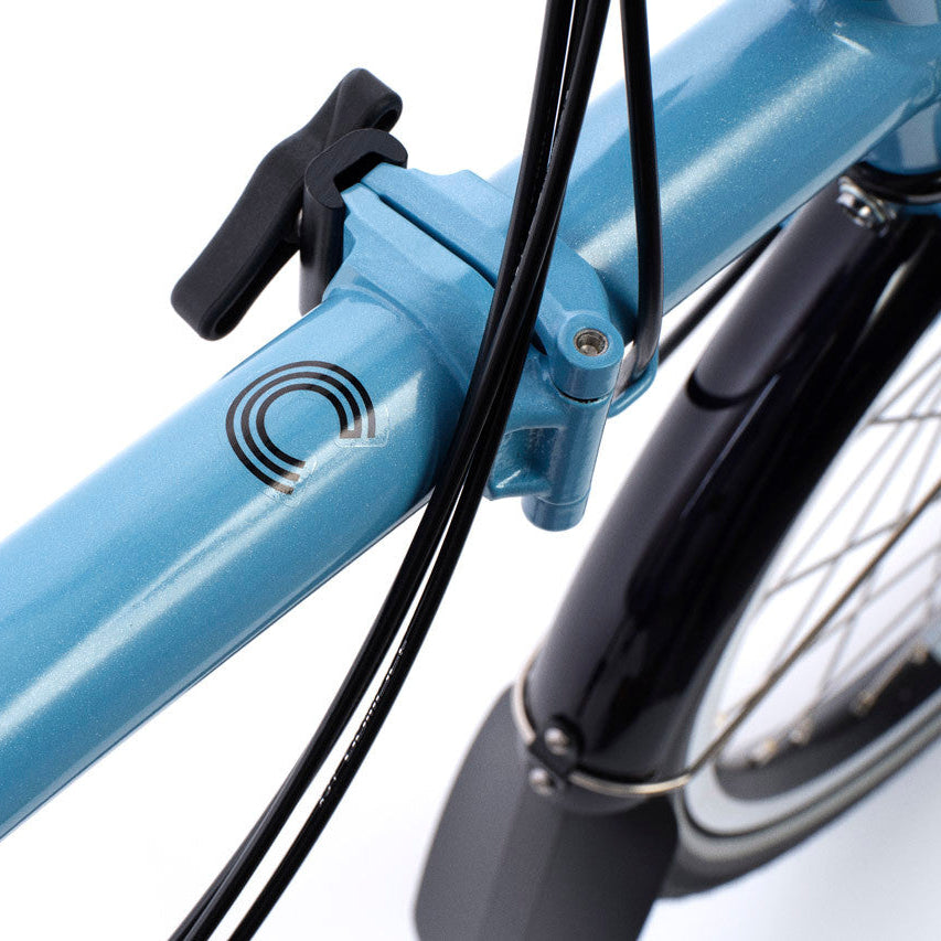 Close-up of a blue bicycle frame on a white background