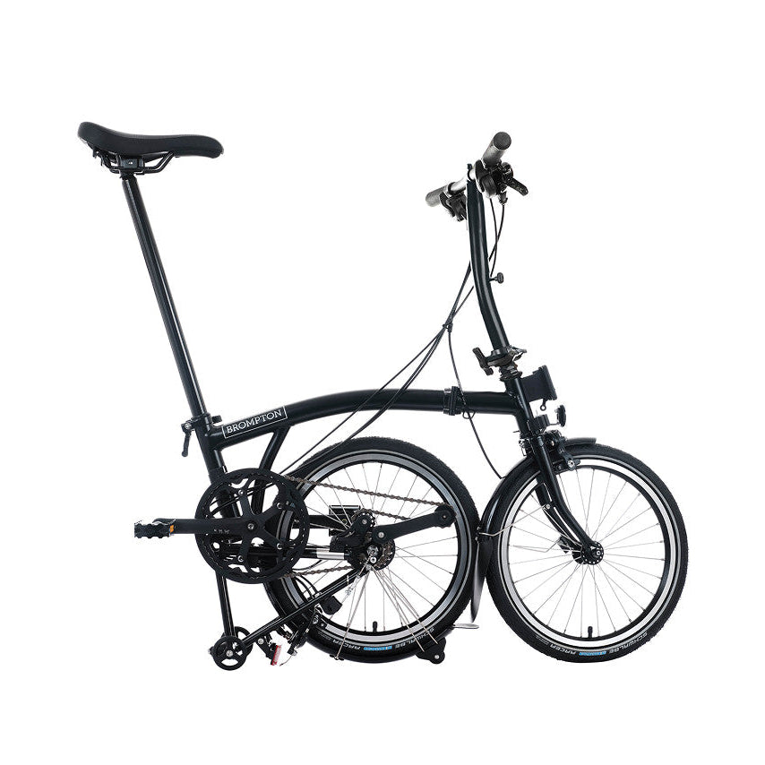 Black folding bicycle on a white background