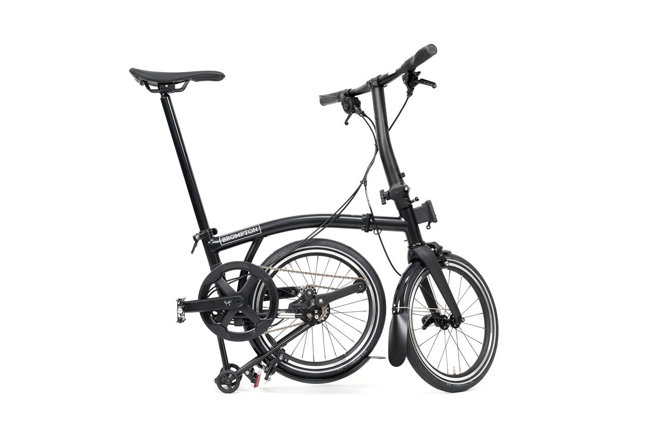 Black folding bicycle on a white background