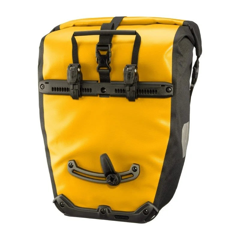Yellow pannier bag with black straps and hardware on a white background