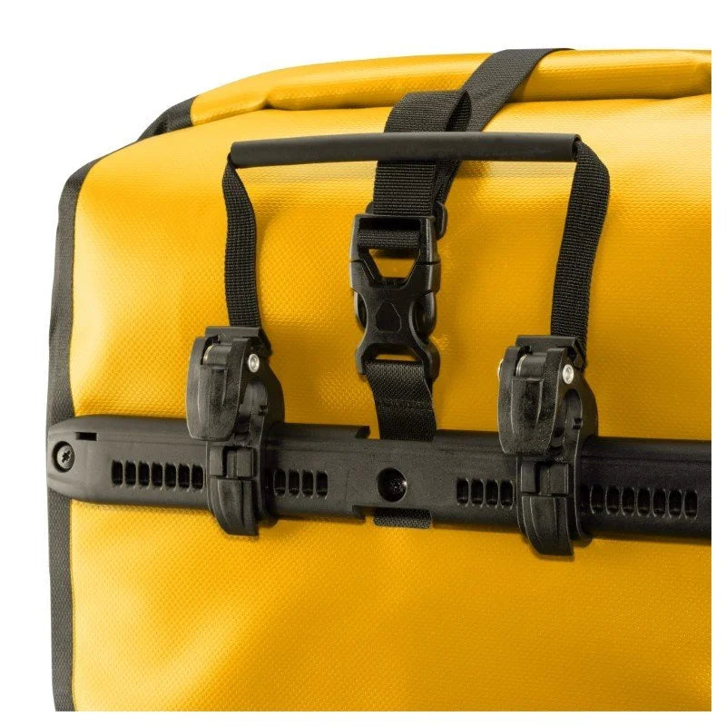 Yellow pannier bag with black straps and buckles on a white background
