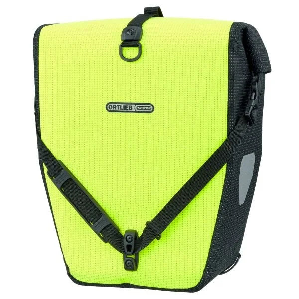 Fluorescent yellow pannier with black straps on a white background
