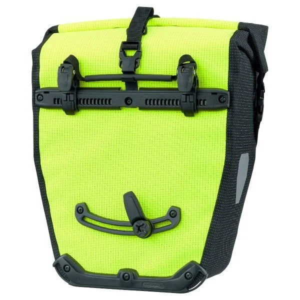 Bright yellow bike pannier bag with black straps on a white background
