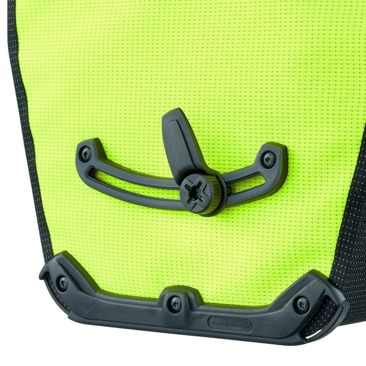 Close-up of a bright green pannier bag with black hardware on a white background