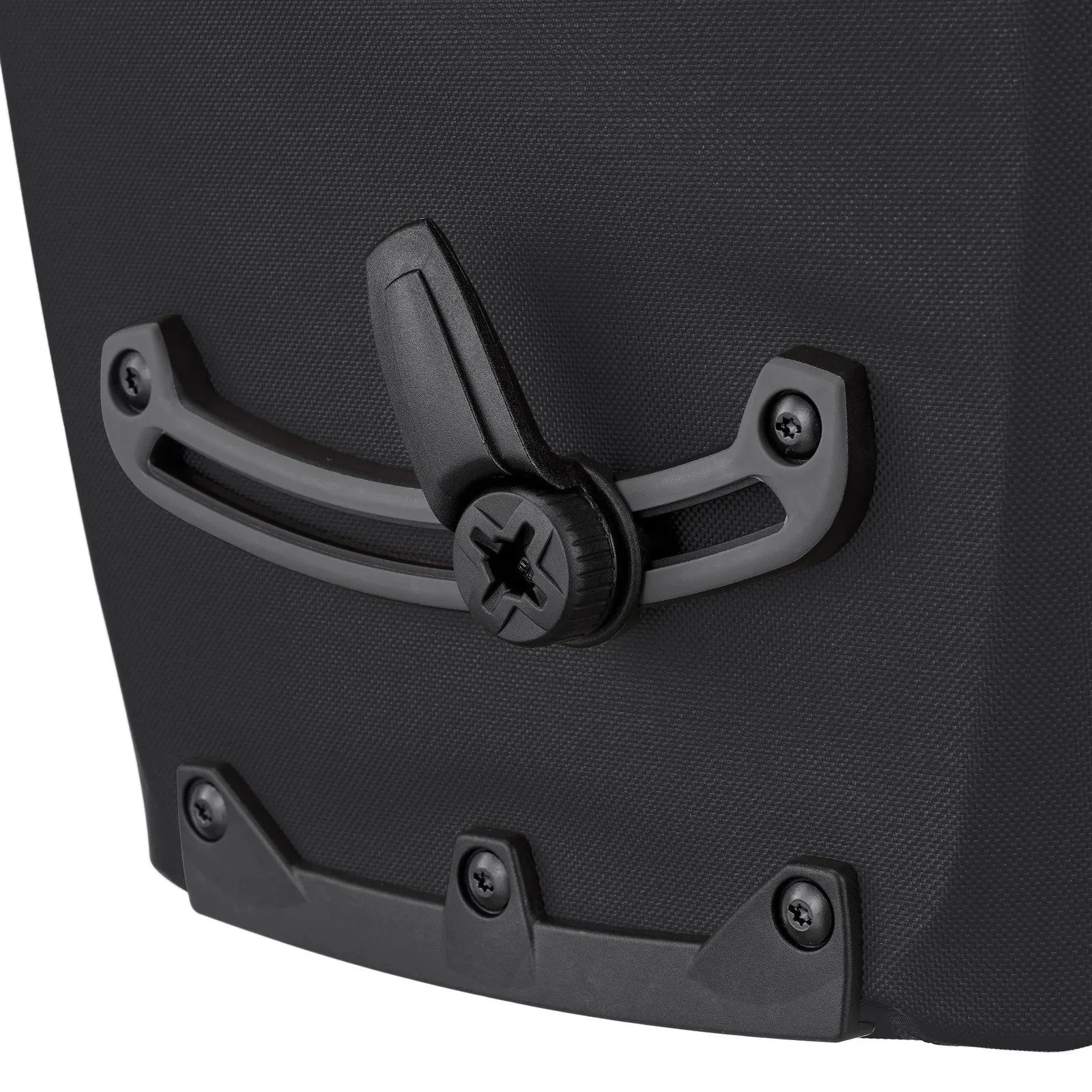 Close-up of a black pannier  handle on a textured black surface