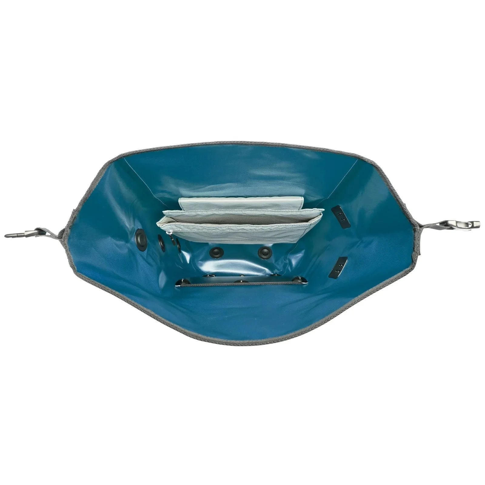 The inside of a blue and gray pannier bag on a white background
