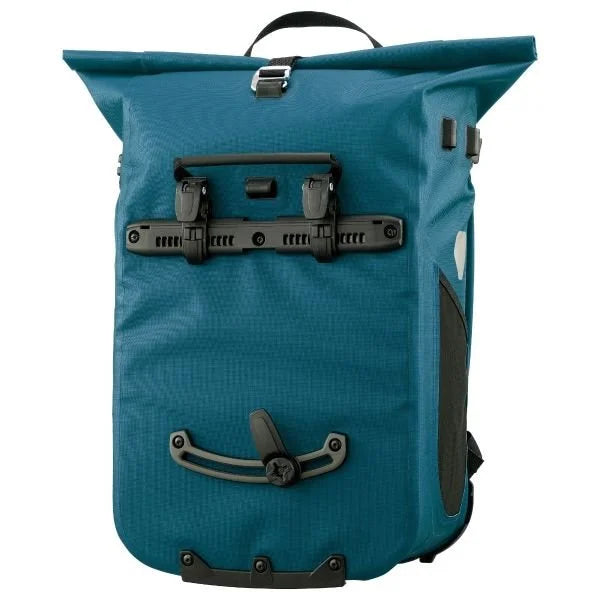 Blue pannier with black straps and hardware on a white background
