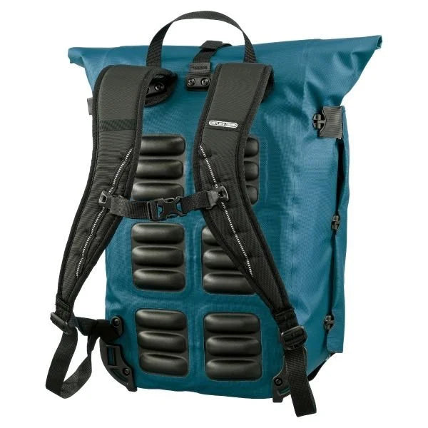Blue pannier with black padding and straps on a white background