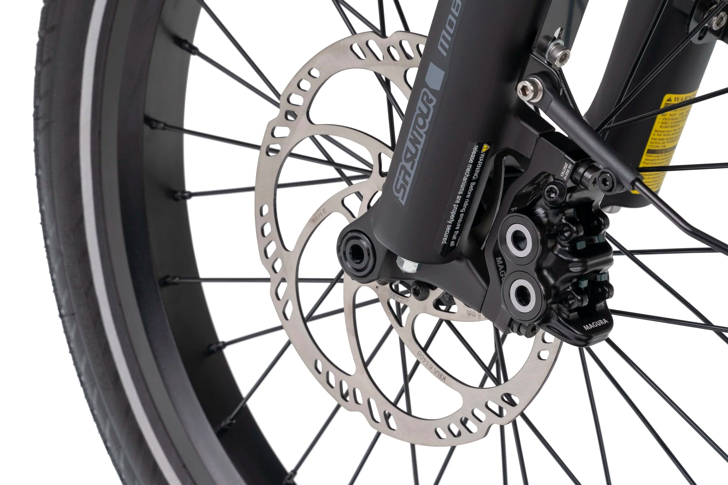 Close-up of a bicycle wheel with disc brake system on a white background