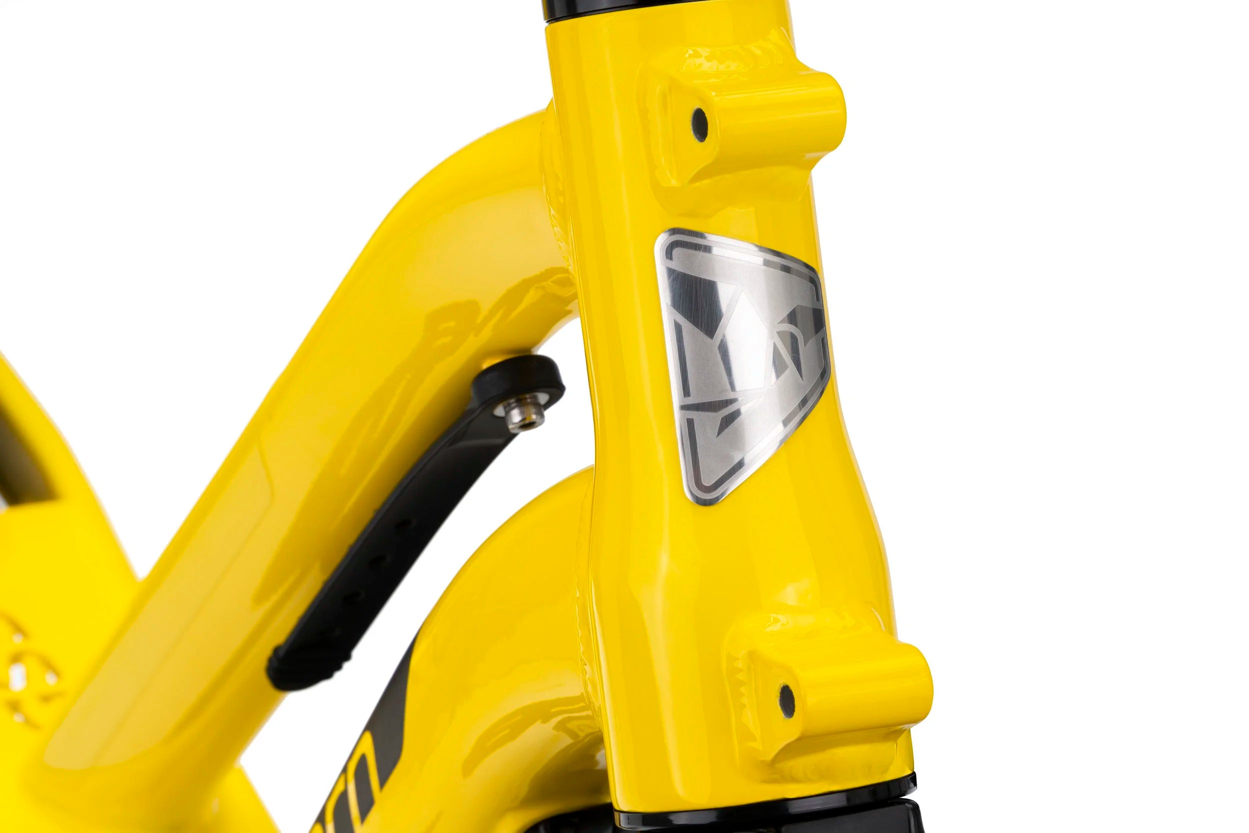 Close-up of a yellow bicycle frame with Tern brand logo on a white background