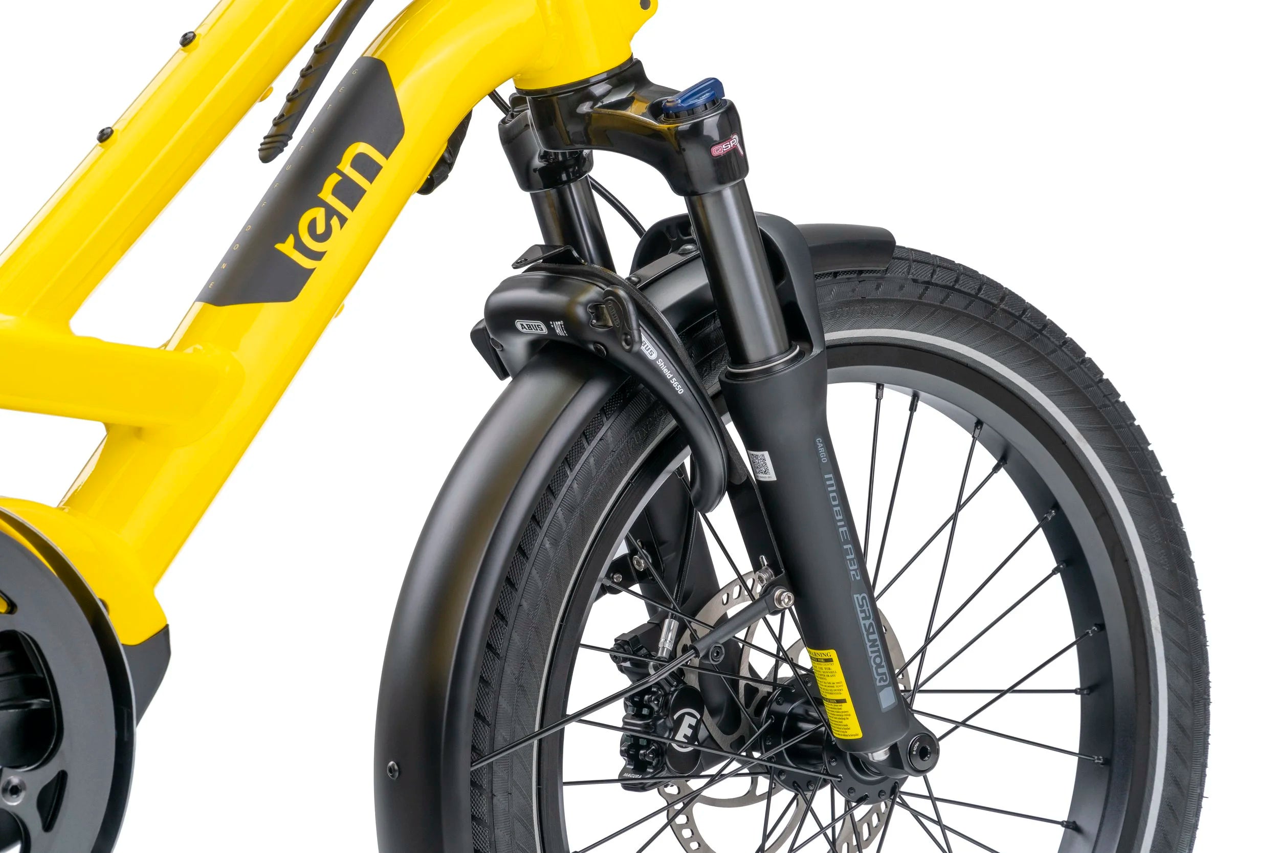 Close-up of a yellow and black bicycle with 'Tern' branding on a white background