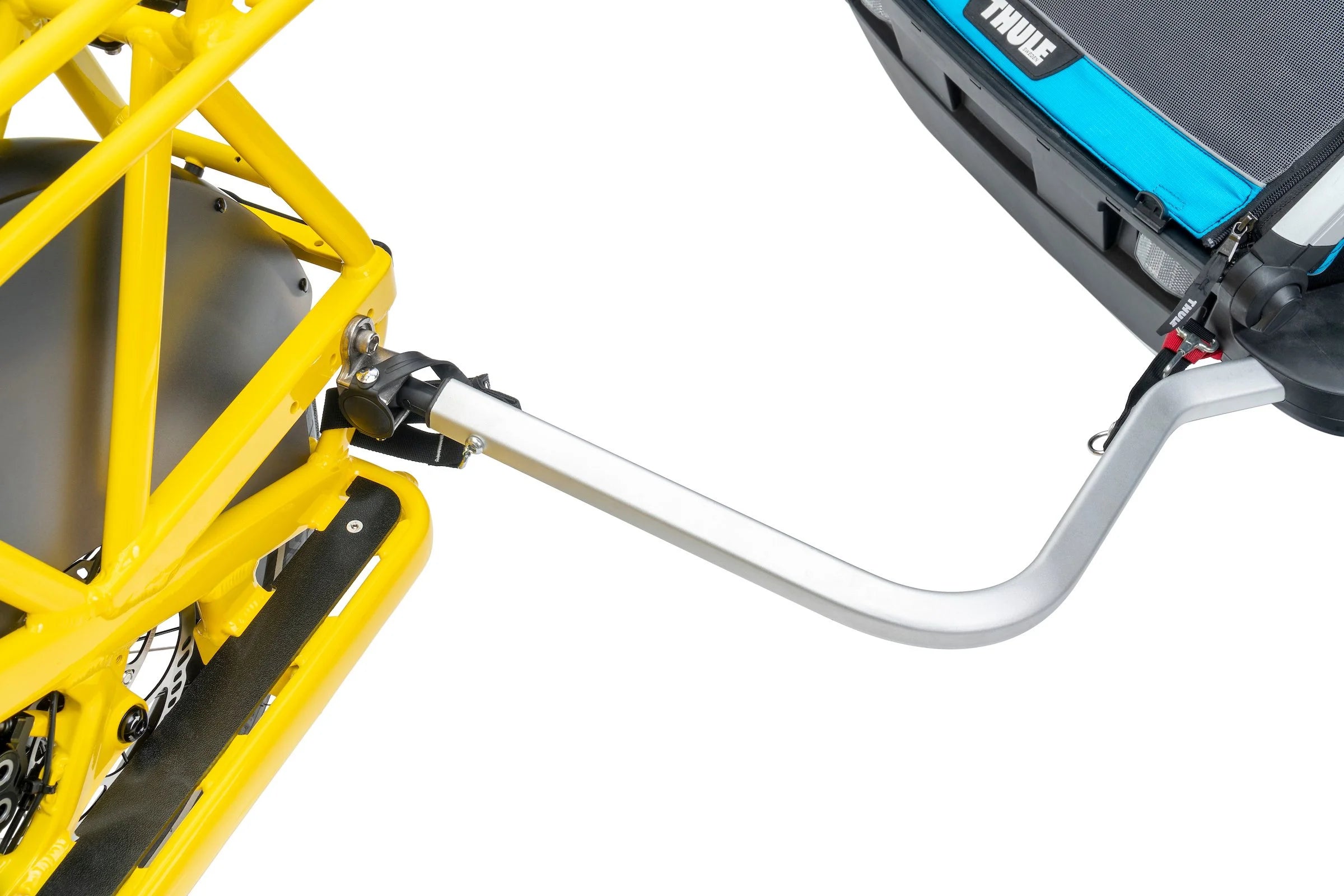 Close-up of a yellow bike trailer with a black and blue Thule cargo box attached.