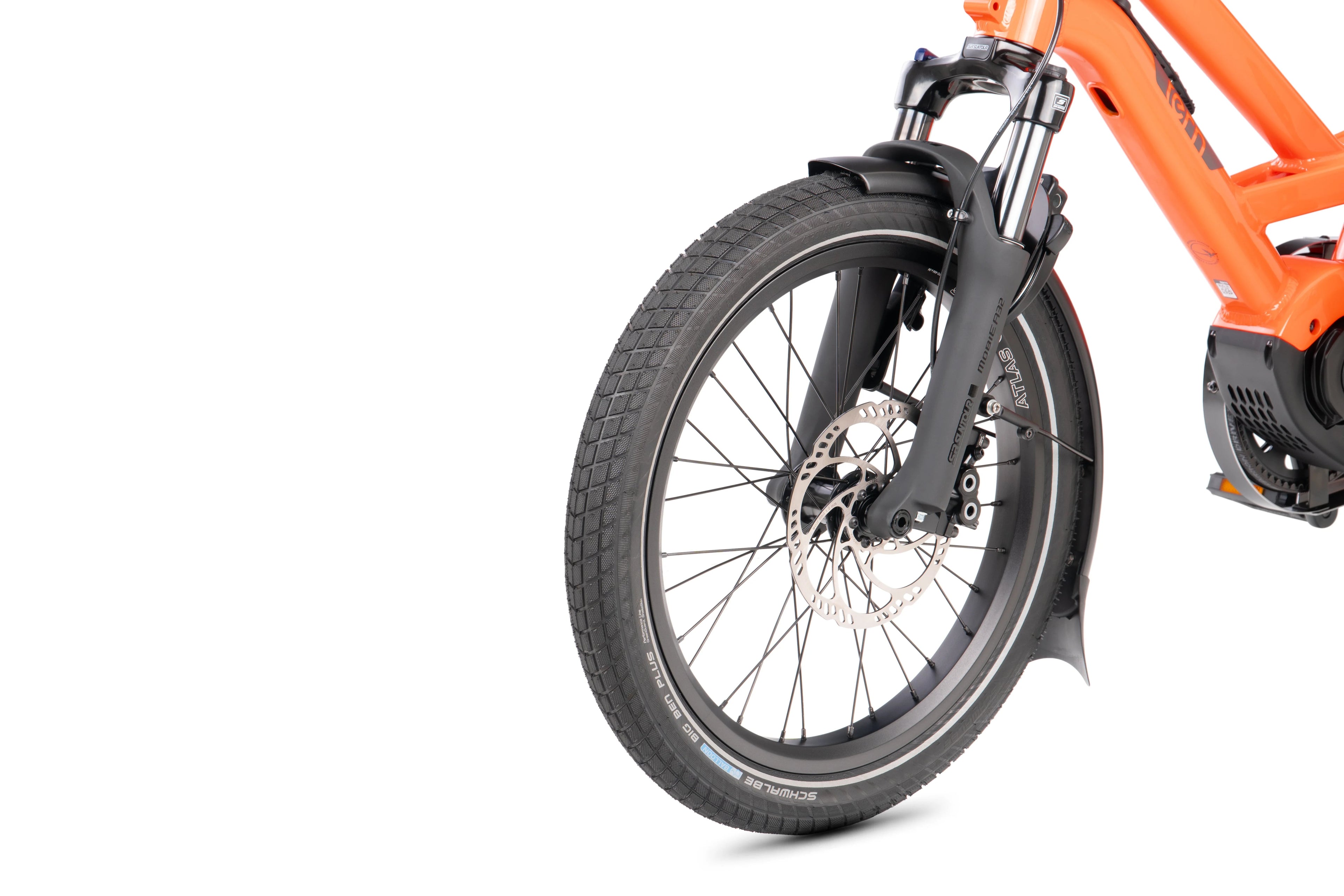 Close-up of an orange electric bike's wheel on a white background