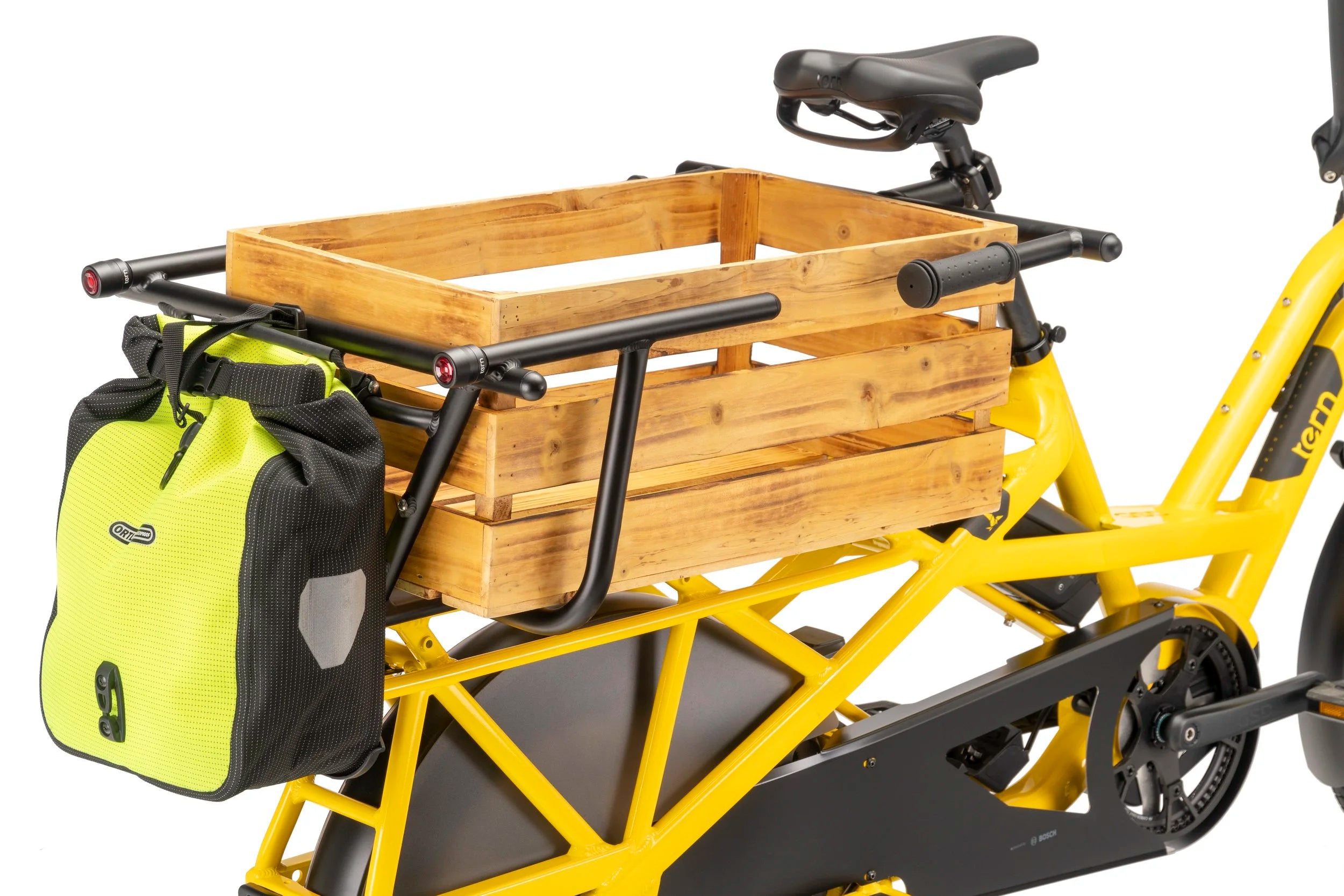 Yellow cargo bike with wooden crate and black bag on a white background