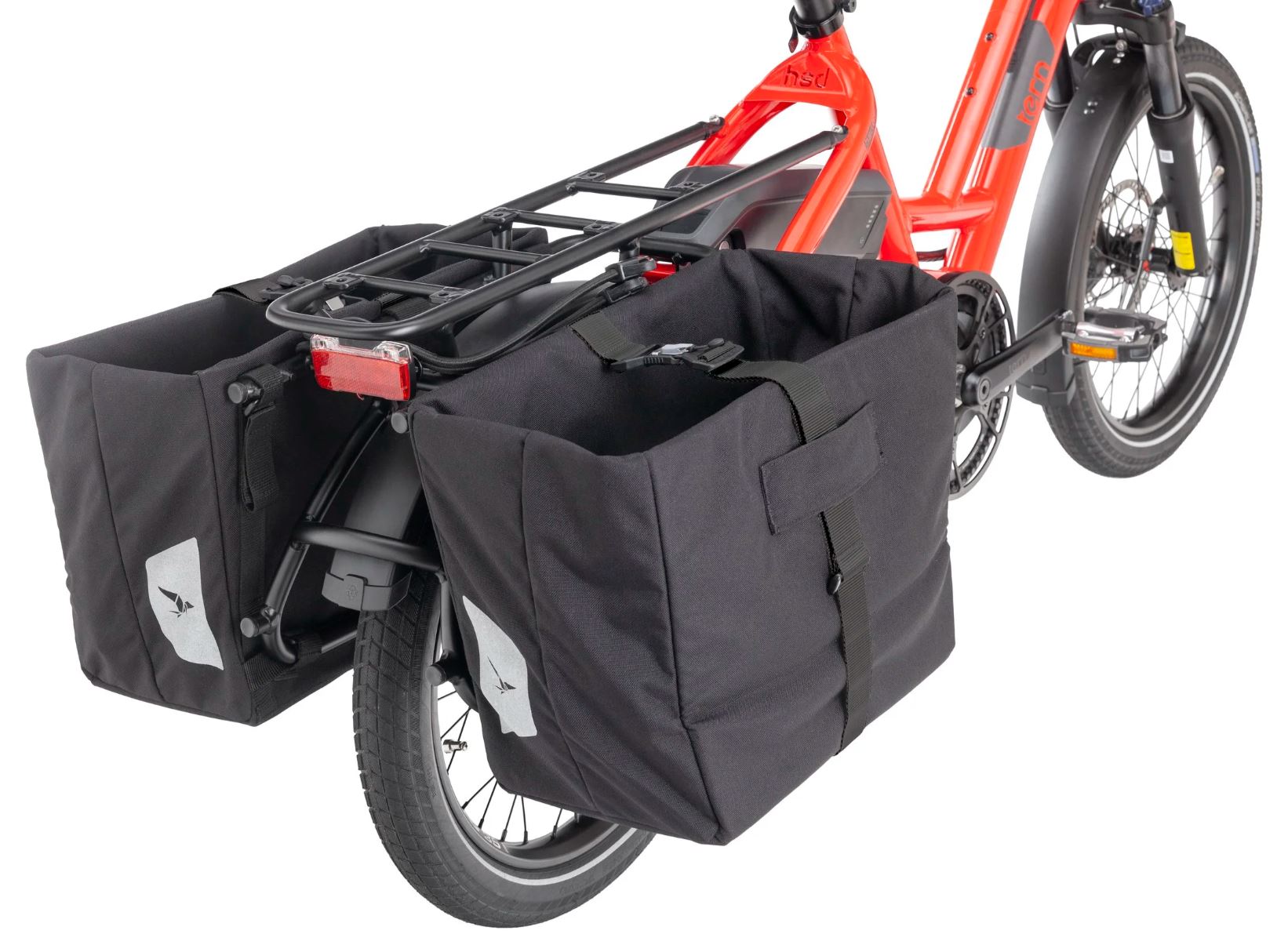 Red electric bike with black pannier bags on a white background