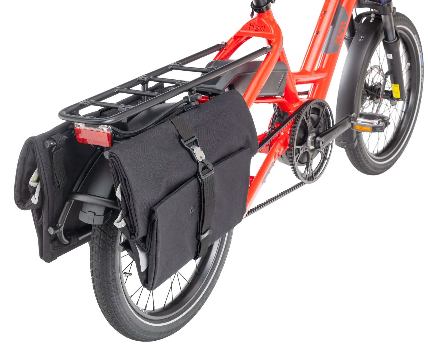 Red bicycle with black panniers on a white background