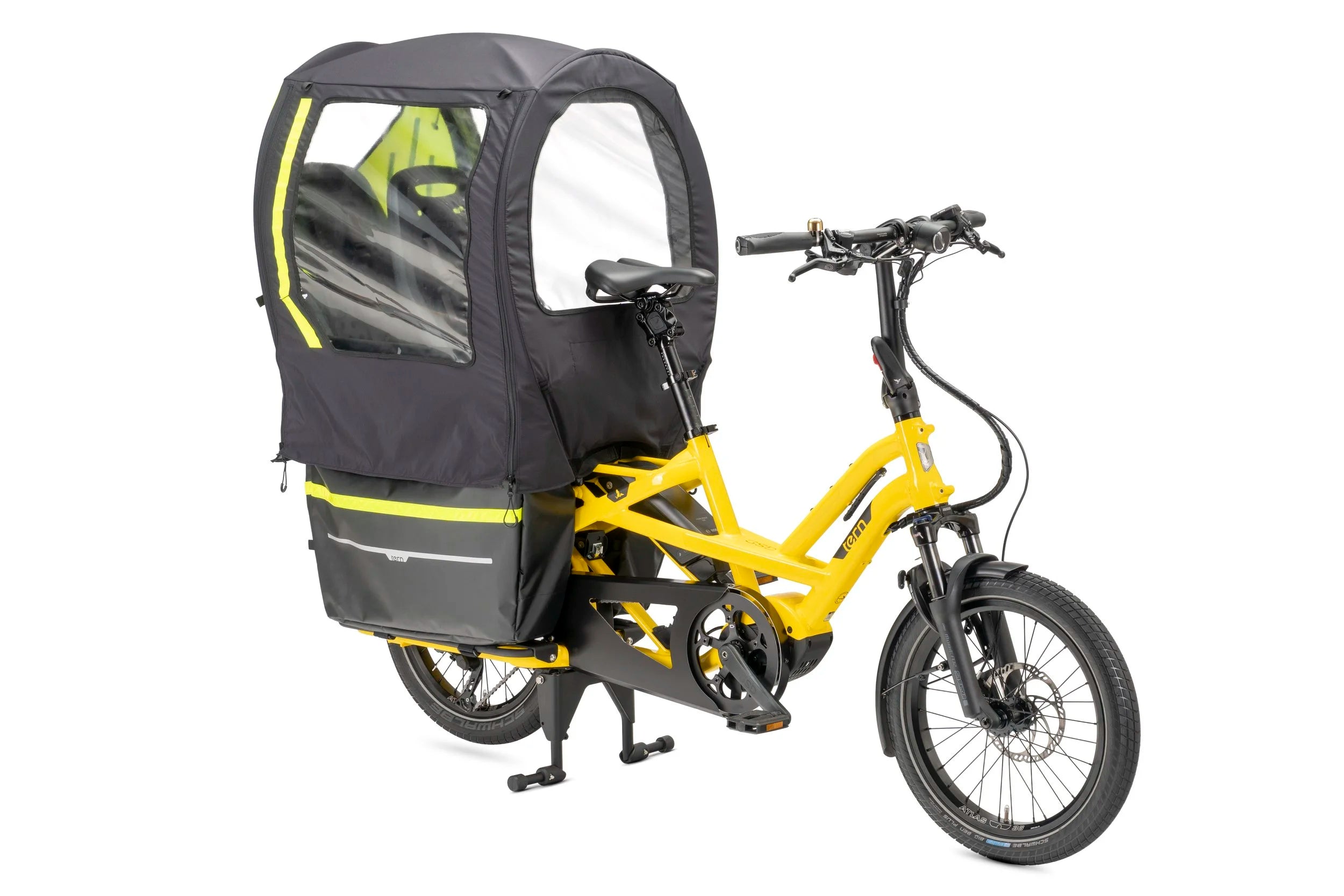 A yellow Tern cargo bicycle with kickstands and a large canopy attached to the rear of the bicycle.