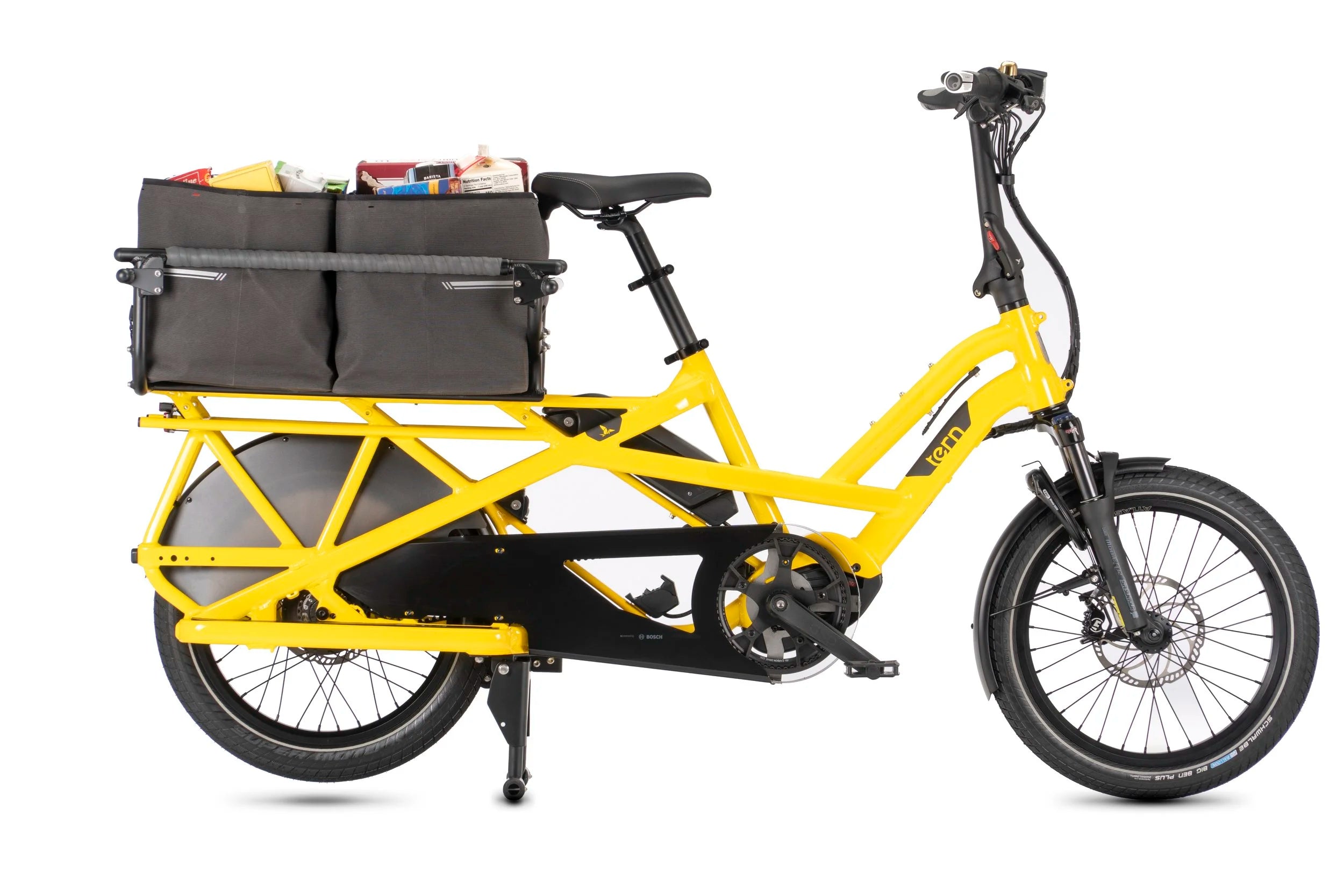 Yellow cargo bike with black storage baskets on a white background