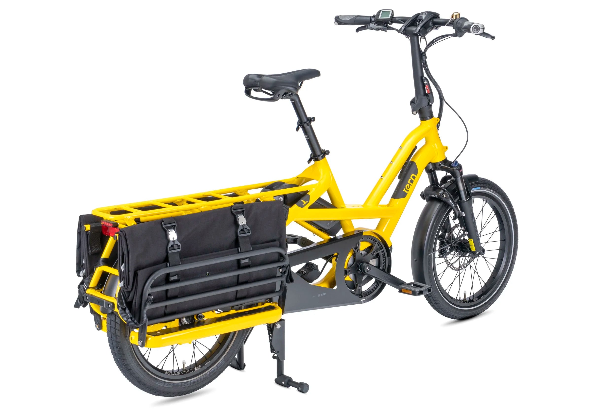 Yellow cargo bike with black attachments on a white background